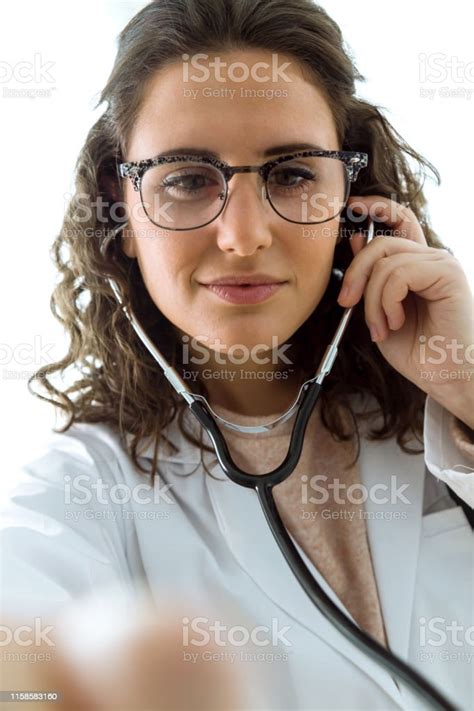 Female Doctor Checking Patient Heartbeat Using Stethoscope Stock Photo