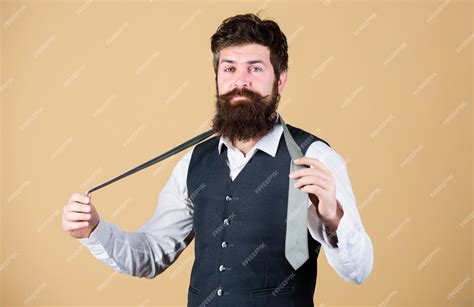 Premium Photo Art Of Manliness Man Bearded Hipster Try To Make Knot