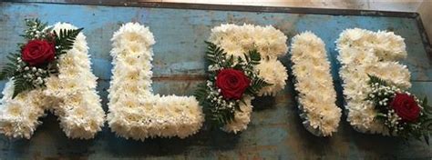 Sg112 name tribute on train. Funeral Flowers - Name Tribute