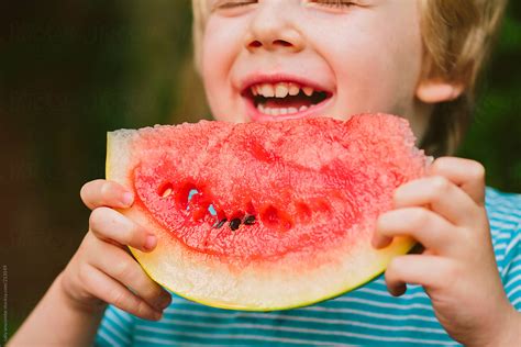 Child Eating Watermelon By Stocksy Contributor Sally Anscombe Stocksy