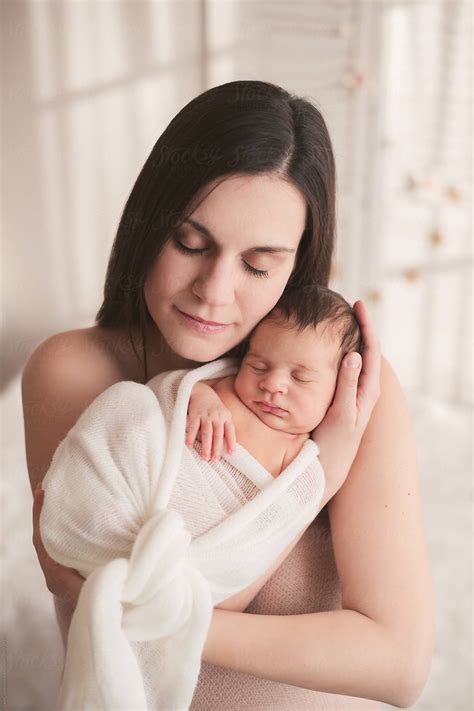Beautiful Mother Holding Her Newborn Baby Tight By Stocksy Contributor Lea Csontos Stocksy