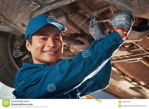 Mechanic Fixing Car Stock Image Image Of Garage Positive 122871693