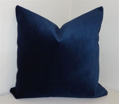 One side bears a hidden zipper closure in the bottom but both sides are constructed to be visible making this pillow reversible. **Mike Pillow Beautiful JB Martin Navy Blue Velvet Pillow ...