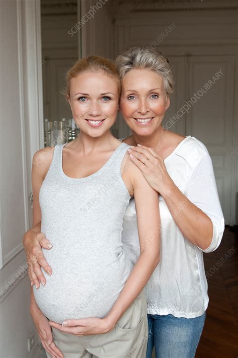 Woman Hugging Pregnant Daughter Stock Image F005 3067 Science Photo Library
