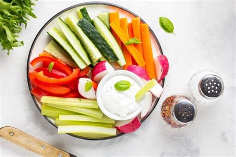 Veggies And Dip With Carrots Red Peppers Cucumbers And Celery