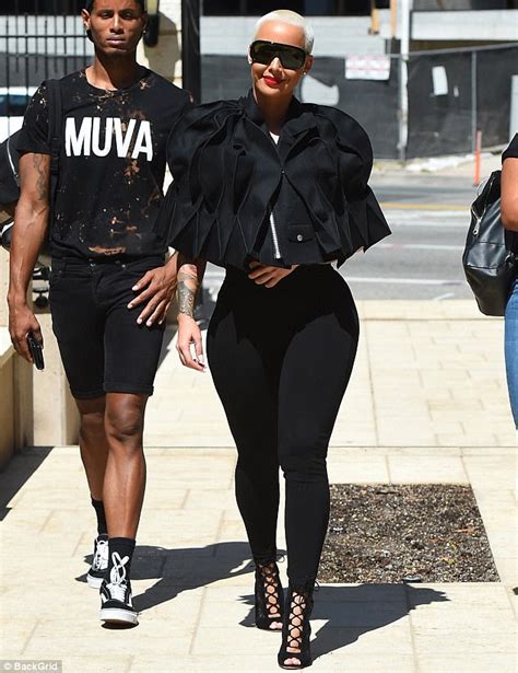 Photos Amber Rose Wears Funky Coat As Squeezes Her Famous Curves In