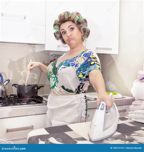 Beautiful Mature Woman With Curlers Ironing Stock Photo Image Of Face