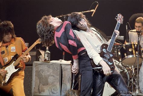 Keith Richards Leaning On Mick Jagger Of The Rolling Stones On Stage At