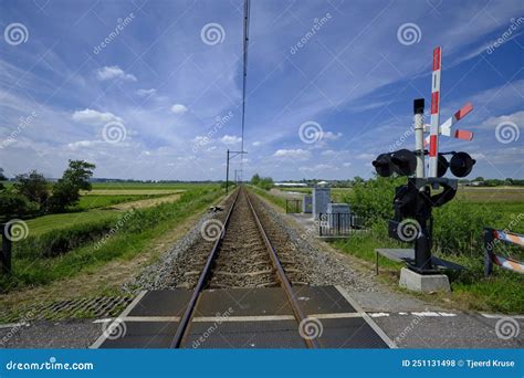 Guarded Railroad Crossing With Open Barriers Red Warning Light And