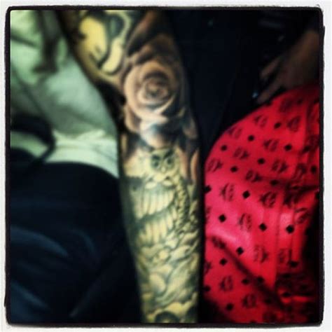 Rose Tattoo Fills Biebers Left Arm