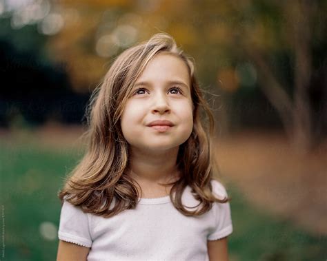 Beautiful Young Girl Looking Up At The Sky By Stocksy Contributor Jakob Lagerstedt Stocksy