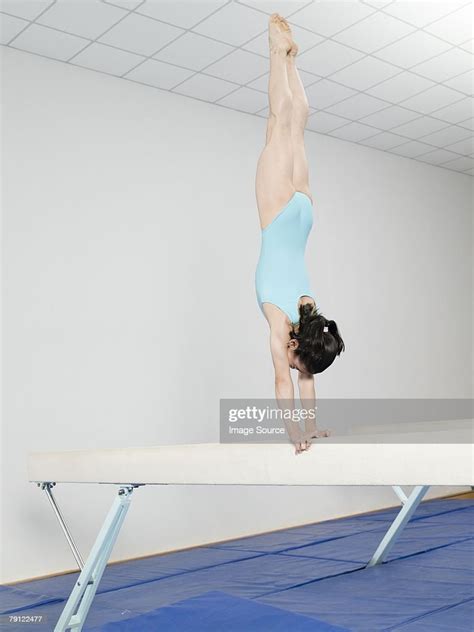Girl Doing Handstand On Balance Beam High Res Stock Photo Getty Images