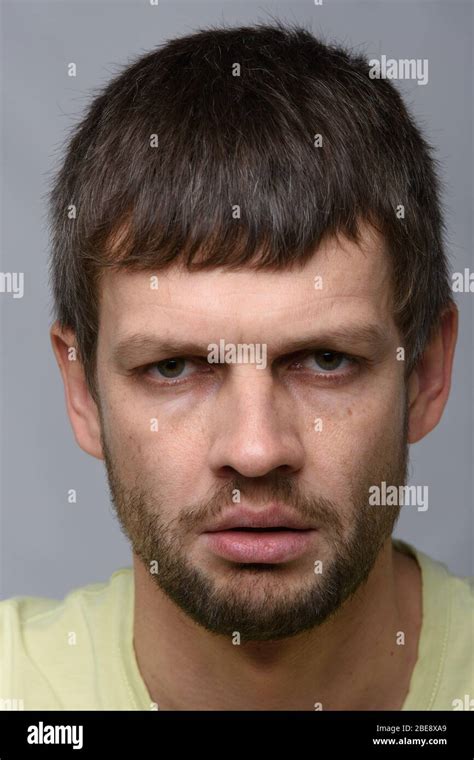 Close Up Portrait Of A Gloomy Man Of European Appearance Stock Photo