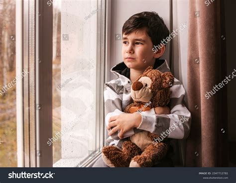 Sad Boy Looks Out Window Rainy Stock Photo 2347712781 Shutterstock