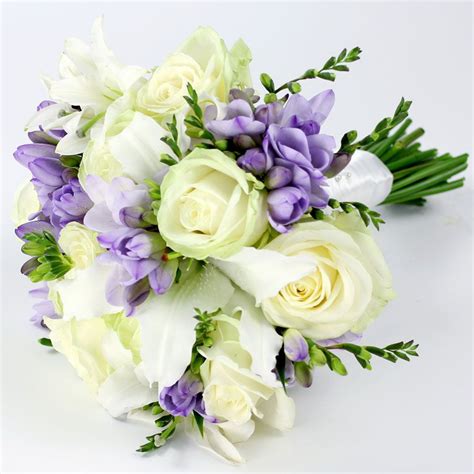 A Bouquet Of White And Purple Flowers