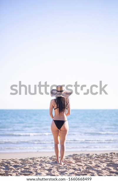 Asian Tourists Wearing Bikini Strolling On Stock Photo