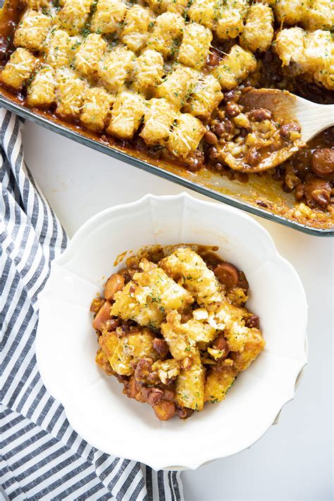 Pour the mixture into prepared pan and top with 1 cup cheddar cheese and 1/4 cup mozzarella cheese. Tater Tot Chili Dog Casserole - The Salty Marshmallow
