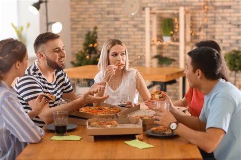 Young People Eating Pizza At Table Stock Photo Image Of Corporate