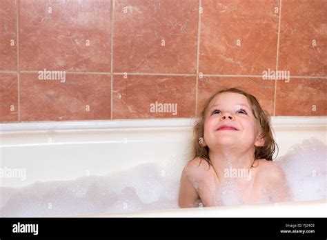 Little Girl Bathes In The Bathtub With Foam Stock Photo Alamy