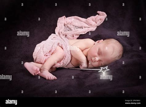 Baby Girl Sleeping In A Blanket 10 Day Old Baby Girl Stock Photo Alamy