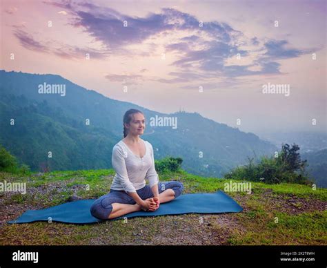 Woman Doing Yoga Asana Baddha Konasana Outdoors Stock Photo Alamy