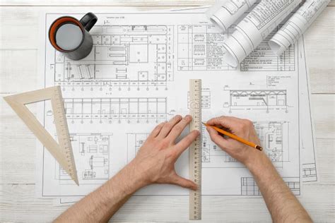 Close Up Hands Of Architect While Working Process With Centimeter Ruler