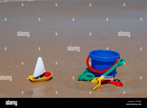 Childrens Beach Toys Buckets Spade And Shovel On Sand On A Sunny