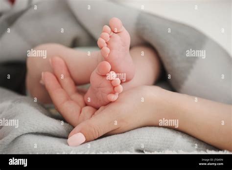 Mother Holding Her Babies Feet Stock Photo Alamy