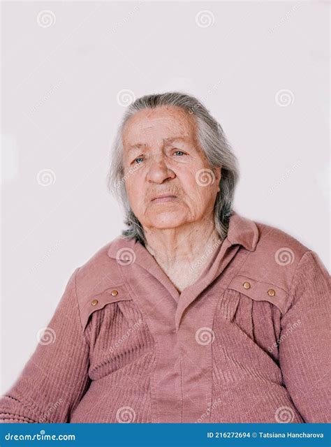 A Large Portrait Of A Grandmother With Deep Wrinkles And Old Age Spots