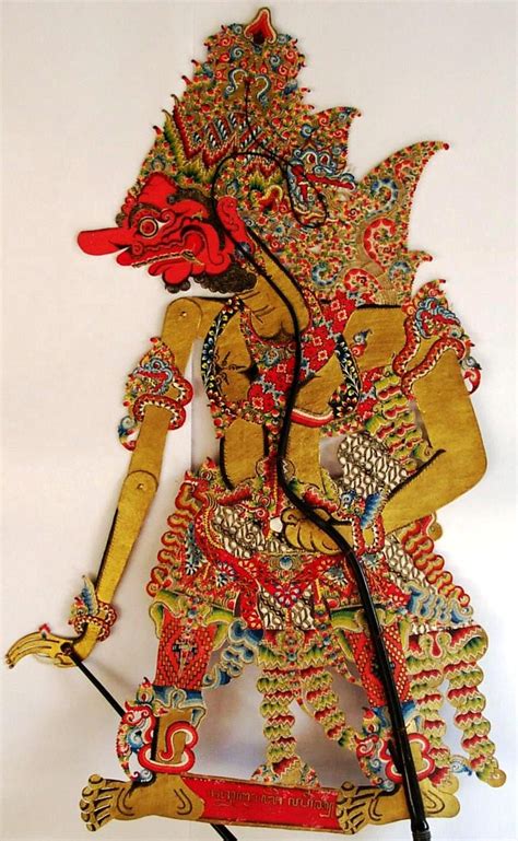 An Intricately Designed Wooden Sculpture With A Red Bird On Its Back