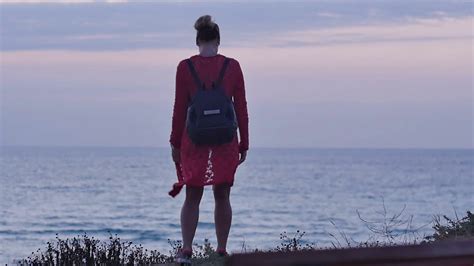 Young Woman Walking On Seashore At Dusk Stock Video Footage Storyblocks