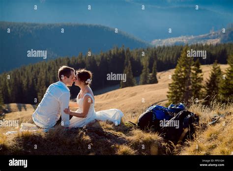 Lovely Romantic Bride And Groom Kissing On The Mountain Peak Honeymoon