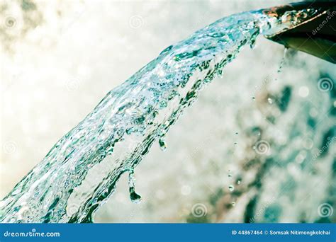 Close Up Of Water Gushing Out Of The Pipe Stock Photo Image