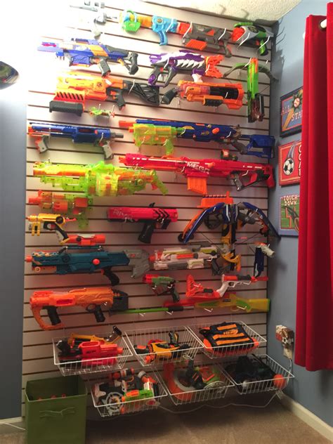 We built some nerf gun wall storage for my nerf gun collection. Nerf gun wall display. This was made from slat wall board ...