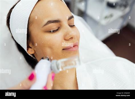Caucasian Woman Getting Face Peeling Procedure In A Beauty Clinic Close Up Rejuvenating Facial