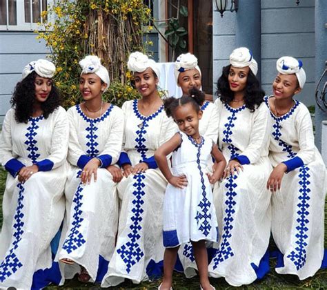 Clipkulture Ladies In White Habesha Kemis With Blue Embroidery And Headwrap Ethiopian