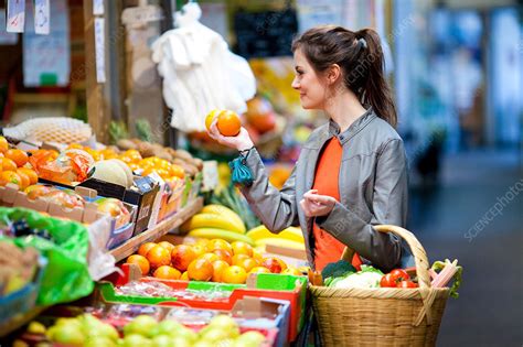 Woman buying food - Stock Image - C031/3413 - Science Photo Library