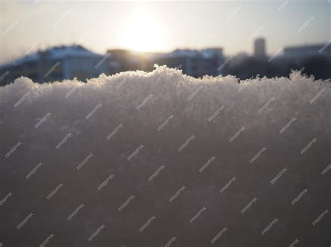 Premium Photo Sunset In The Winter Snow And Snowflakes City Skyline