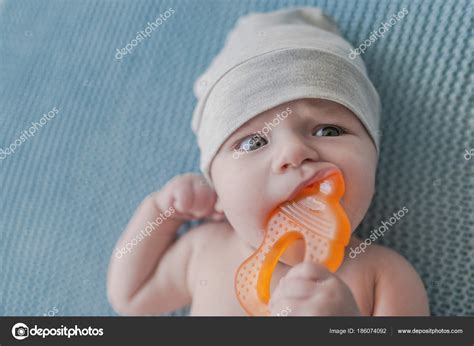Baby Boy Playing Teether Chewing Toy Baby Chewing Teething Ring Stock
