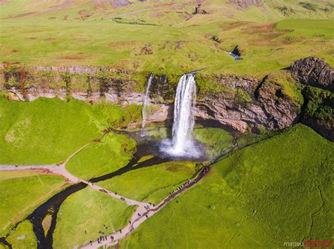 Aerial Drone View Of Seljalandsfoss Waterfall With Tourists Iceland