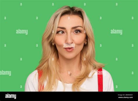 Closeup Portrait Of Funny Awkward Adult Woman Crossing Eyes And Rounding Lips Playing Fool