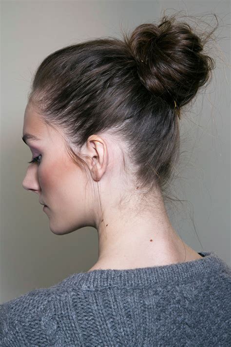 This sleek style features a razor crisp side part and works well with a natural cowlick. How to Wear a Messy Bun With Long Hair | StyleCaster