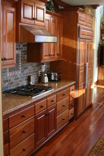 We wanted to lighten up the room, as we live on a wooded. Cherry Kitchen with Slate Backsplash - traditional ...