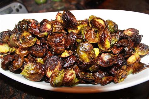 Bump roasted brussels sprouts up to another level of flavor with bacon and garlic cloves. Easy, Paleo Oven Roasted Brussels Sprouts