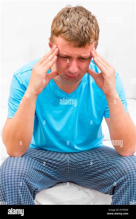 Portrait Of Pensive Depressed Man Sitting On The Bed Stock Photo Alamy
