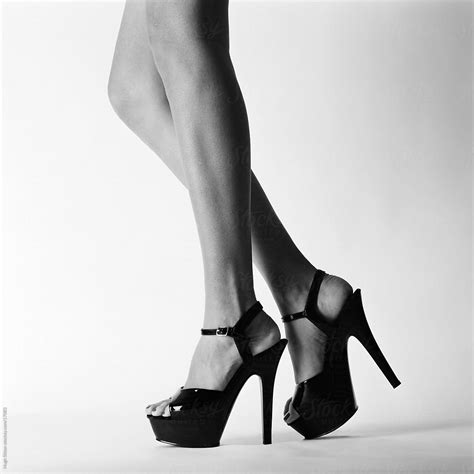 Close Up Of Woman S Legs Wearing High Heel Shoes By Hugh Sitton Stocksy United