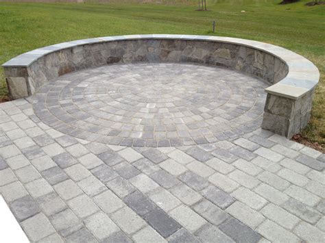 A Beautiful Paver Patio With A Stone Seatingborder Wall