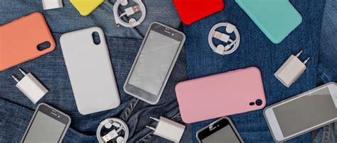 Premium Photo Texture Of Mobile Phone Accessories On A Denim Background