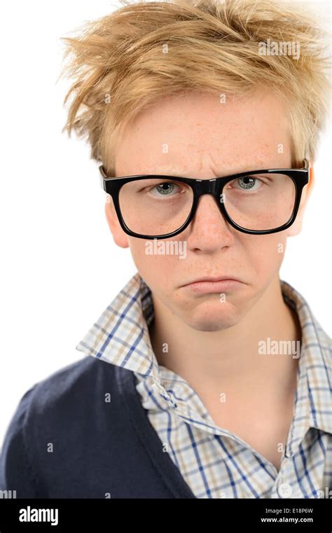 Angry Teenage Nerd Boy Wearing Geek Glasses Against White Background