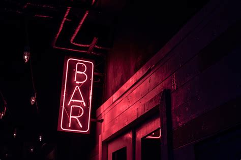 Neon Bar Sign On The Doorway Of A Drinking Establishment Stock Photo